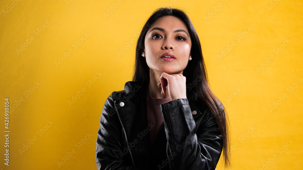 Portrait of a young beautiful woman against a neutral background - studio photography Portrait of a young beautiful woman against a neutral background - studio photography