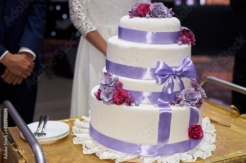 Photo by Bwedding desserts on the table. beautiful wedding cake, party, marriage. Elegant wedding cake during reception. Newlyweds wedding cakeelenussov Sergo photo