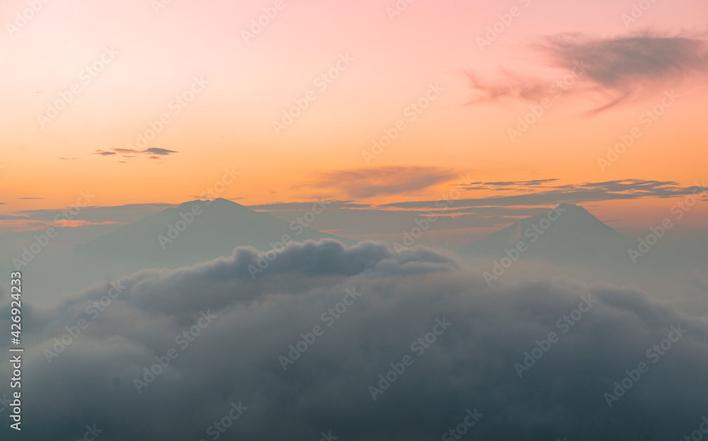 The atmosphere of the sunrise time on Mount Sumbing with clouds
