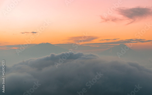 The atmosphere of the sunrise time on Mount Sumbing with clouds