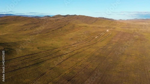 Surroundings of Lake Baikal. Tazheran steppe in autumn. Aerial view. photo