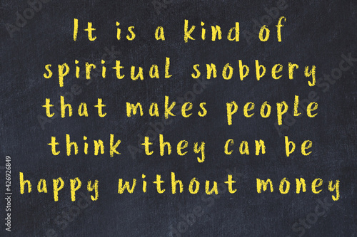 Chalk inscription of smart quote on black desk