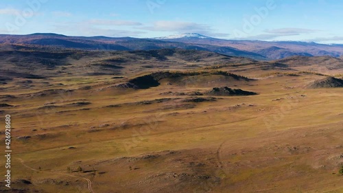 Surroundings of Lake Baikal. Tazheran steppe in autumn. Aerial view. photo