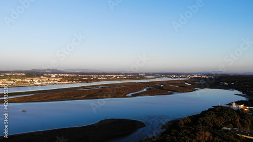 Aerial view of the Northern Litoral Natural Park in Ofir, Esposende, Portugal. The Cavado River estuary at sunset.