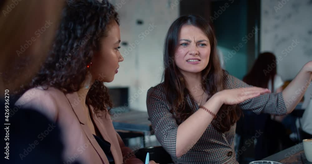 Portrait of young happy beautiful 25-30 Caucasian woman meeting friends, casually talking and smiling at modern cafe. Portrait of young happy beautiful 25-30 Caucasian woman meeting friends, casually talking and smiling at modern cafe.