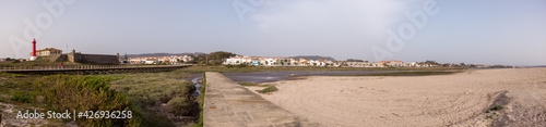 Panoramic shot of the Farol de Esposende (Esposende Lighthouse) set in front of the Fort of Sao Joao Baptista de Esposende is situated at the mouth of Cavado river, north of Portugal.