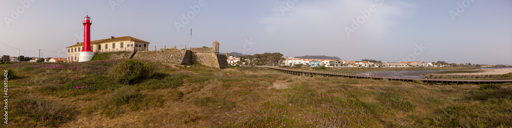 Panoramic shot of the Farol de Esposende (Esposende Lighthouse) set in front of the Fort of Sao Joao Baptista de Esposende is situated at the mouth of Cavado river, north of Portugal.