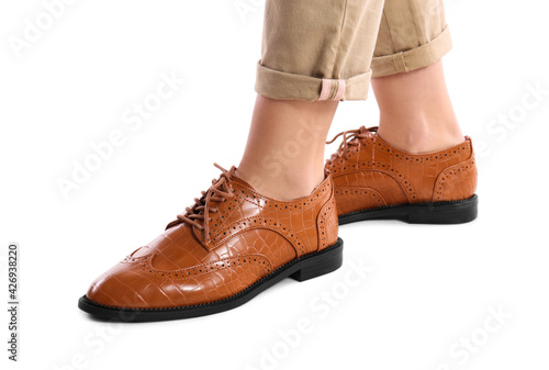 Woman in stylish shoes on white background, closeup