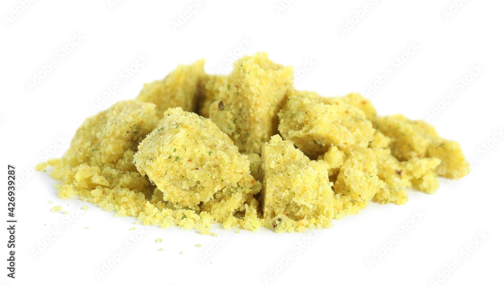 Aromatic crumbled bouillon cube on white background Aromatic crumbled bouillon cube on white background
