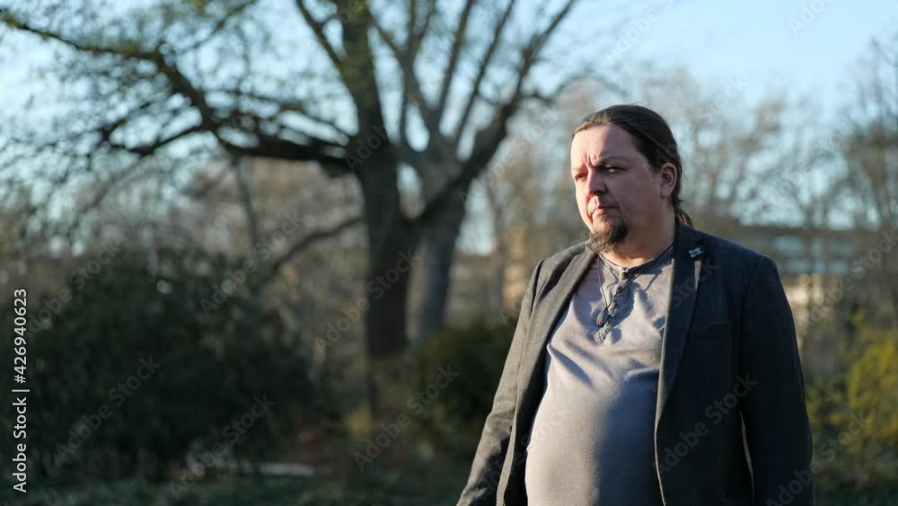 [4k] middle aged long haired goatee man putting of head pointing shaking head