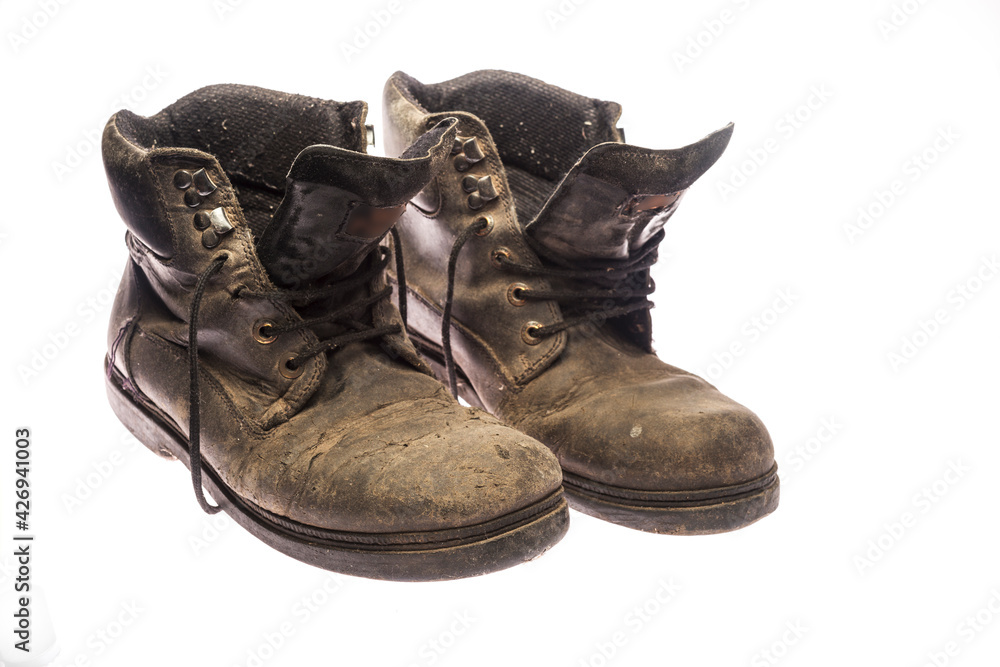 old pair of very worn black shoes