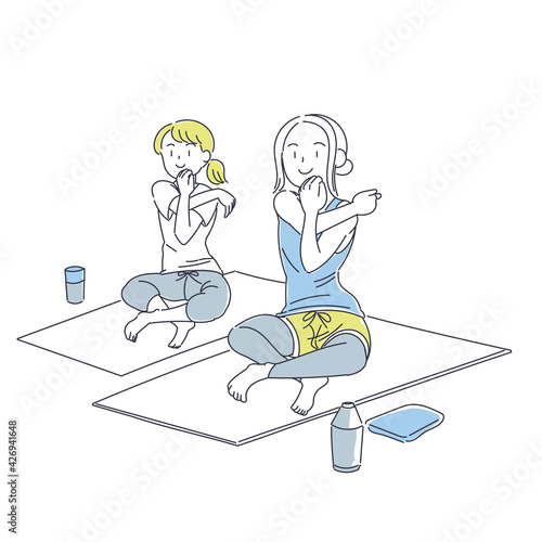 フィットネススタジオでヨガをする女性たち