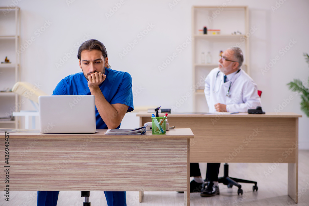 Two doctors working in the clinic Two doctors working in the clinic