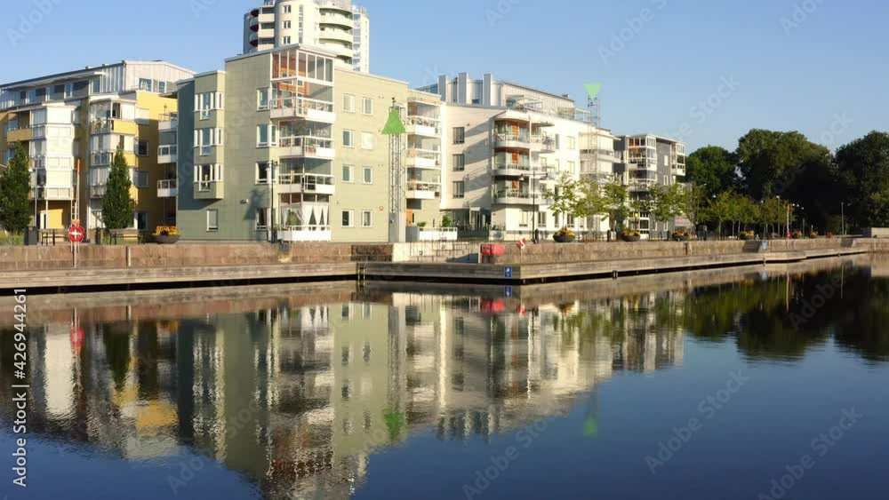 Houses reflection in the canal. High quality 4k footage Houses reflection in the canal. High quality 4k footage