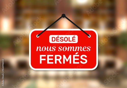 Door sign shop panel write in french désolé nous sommes fermés means sorry we are closed on store entrance.