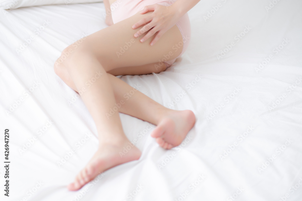Young asian woman touch skin leg smooth with cream and lotion for hydration and smooth, girl applying body care and cosmetic for silky and soft, beauty perfect with wellness, health and care. Young asian woman touch skin leg smooth with cream and lotion for hydration and smooth, girl applying body care and cosmetic for silky and soft, beauty perfect with wellness, health and care.
