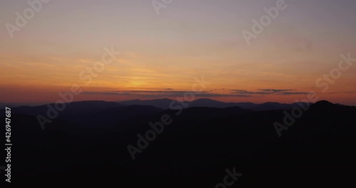 Mountain landscape, sunset and silhouette of mountain hills, 4k video