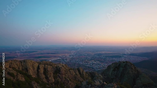 Aerial view toward city from mountain hill, 4k video	