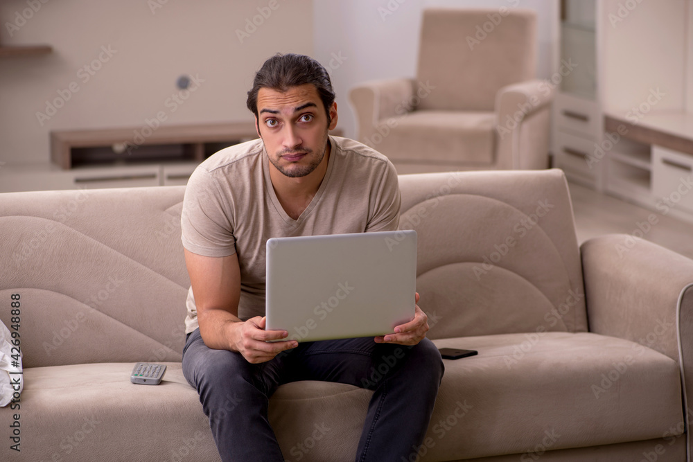 Young male freelancer working at home Young male freelancer working at home