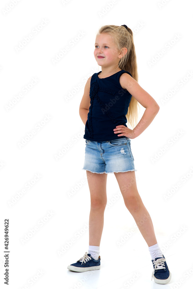 Cute girl standing with hands on her waist Cute girl standing with hands on her waist