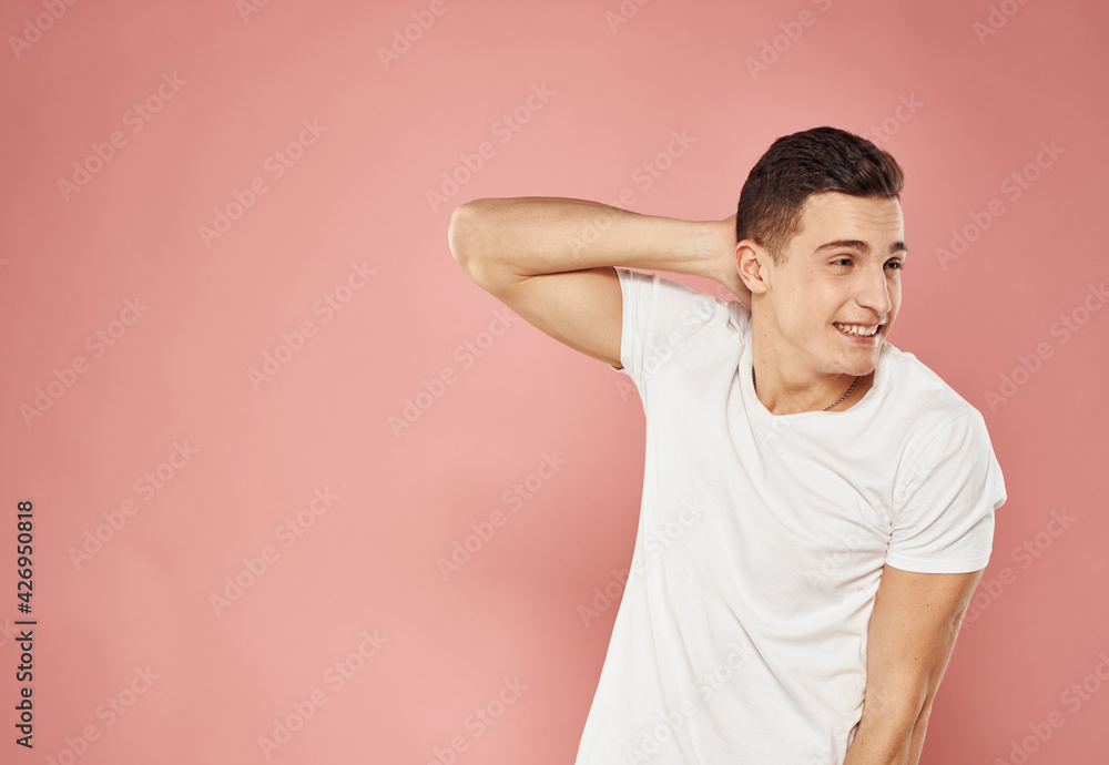 handsome man in white t-shirt emotions joy pink background handsome man in white t-shirt emotions joy pink background