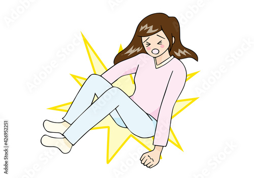 尻もちをついて転倒する女性