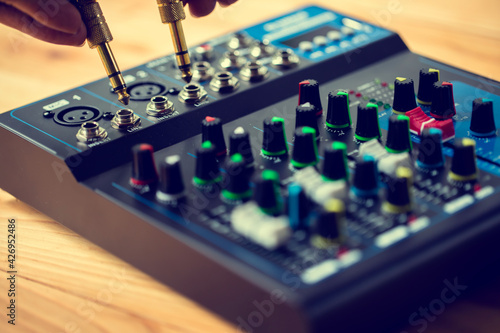 Selective focus to sound electronics mixer and gold mic jack.