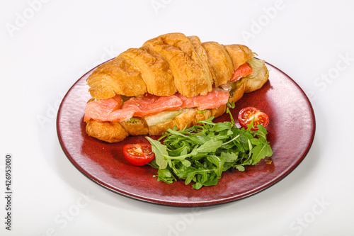 Croissant with salmon for breakfast