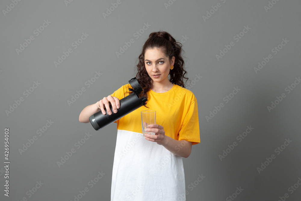 woman holding eco reusable smart thermo water bottle with drink reminder, healthy lifestyle concept woman holding eco reusable smart thermo water bottle with drink reminder, healthy lifestyle concept