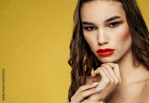 Woman nude shoulders brunette curly hair model makeup