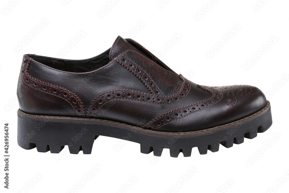 brown fashionable men's leather shoe with a thick sole with protectors, located horizontally, on a white background brown fashionable men's leather shoe with a thick sole with protectors, located horizontally, on a white background
