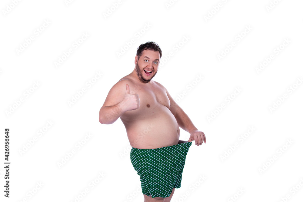 Funny fat man and male health problems. Stock Photo | Adobe Stock