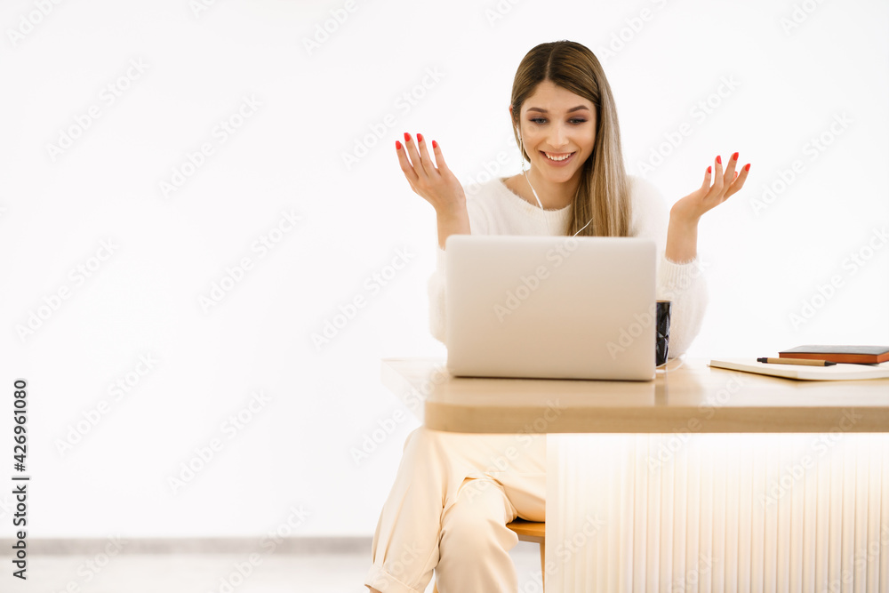 Smiling mixed race lady freelancer, communicating with client via video computer call. Millennial pleasant professional female tutor giving online language class. Smiling mixed race lady freelancer, communicating with client via video computer call. Millennial pleasant professional female tutor giving online language class.