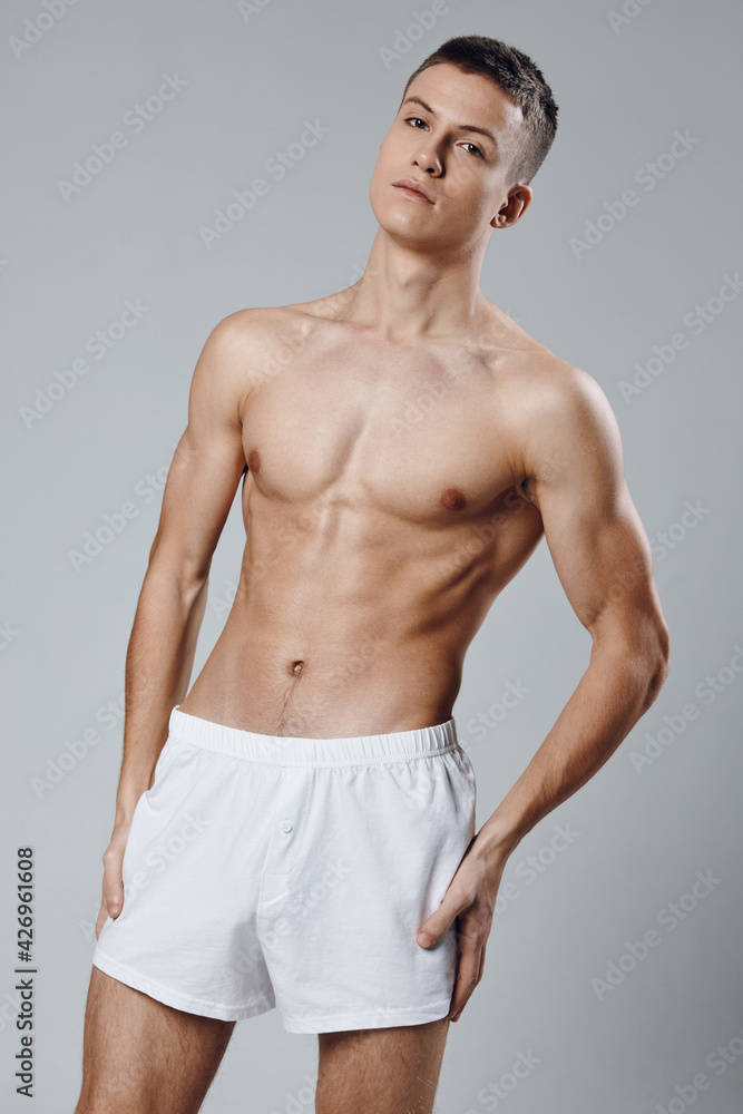 Fototapeta premium male with a naked torso athlete pumped up arm muscles 
