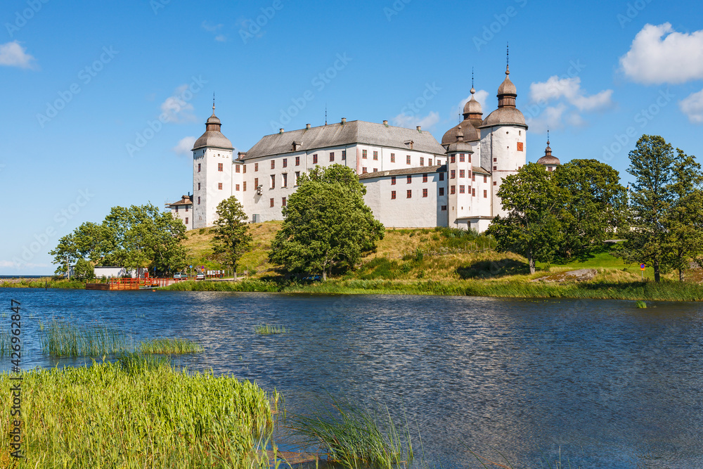 Lacko castle on a hill by a lake Vanern