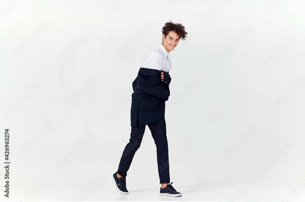 business man in suit and curly hair emotions light background fashion business man in suit and curly hair emotions light background fashion