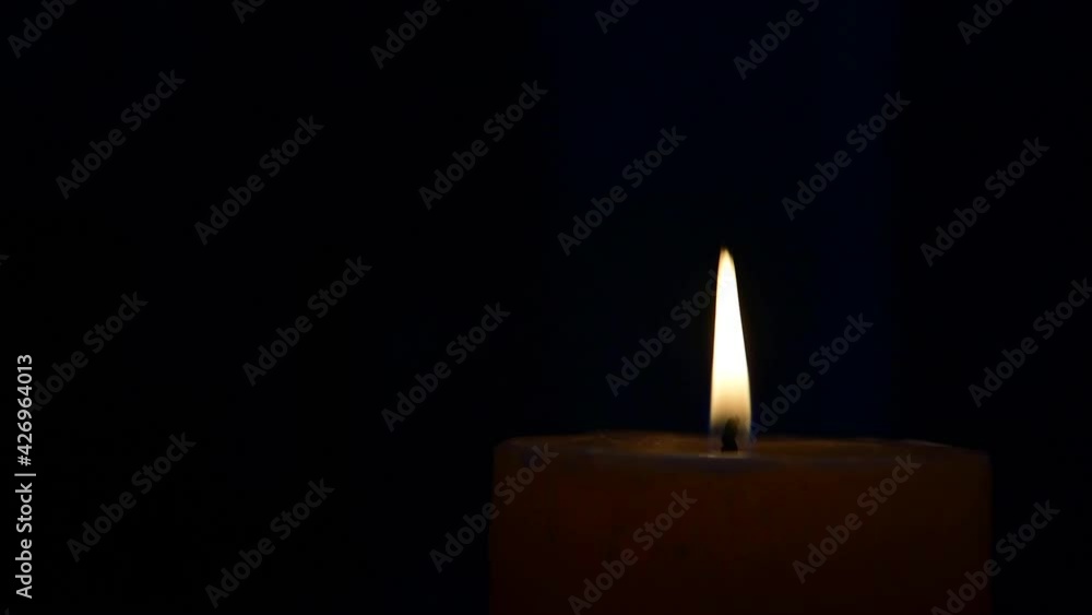 Blowing the already burning candle with a blow including the ambient sound of the blow Blowing the already burning candle with a blow including the ambient sound of the blow