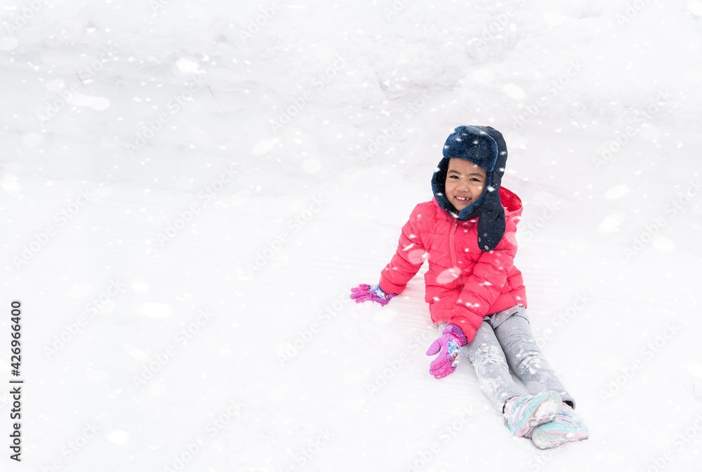 Happy girl plays with a snow in sunny winter day Happy girl plays with a snow in sunny winter day