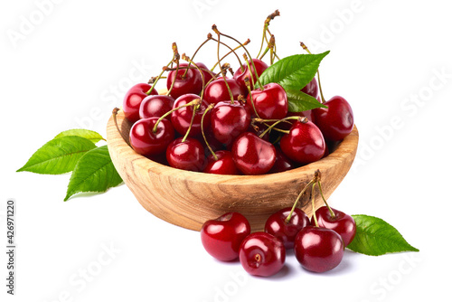 wooden bowl of sweet cherry fruits isolated on white background