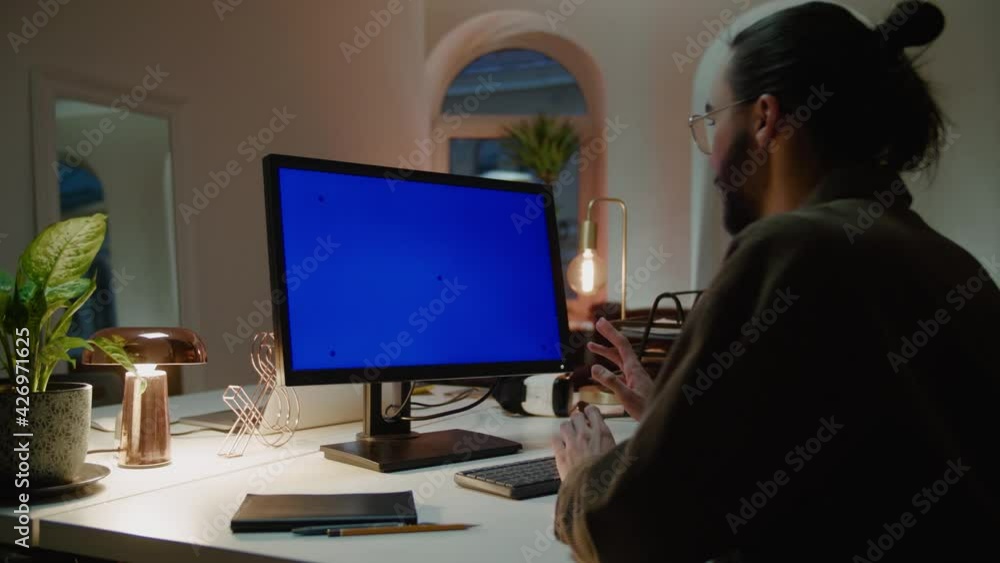 Company manager with bun beard and glasses at online meeting Company manager with bun beard and glasses at online meeting
