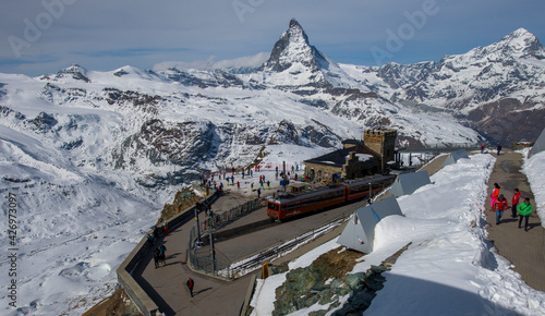 train stop in swiss alps on high altitude under Matterhorn in the back  photo