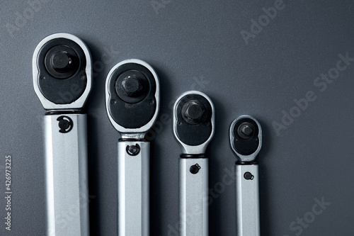 Torque wrenches set or spanners car repair. Tools for professional or self-repair car. Dark gray background. View from above.