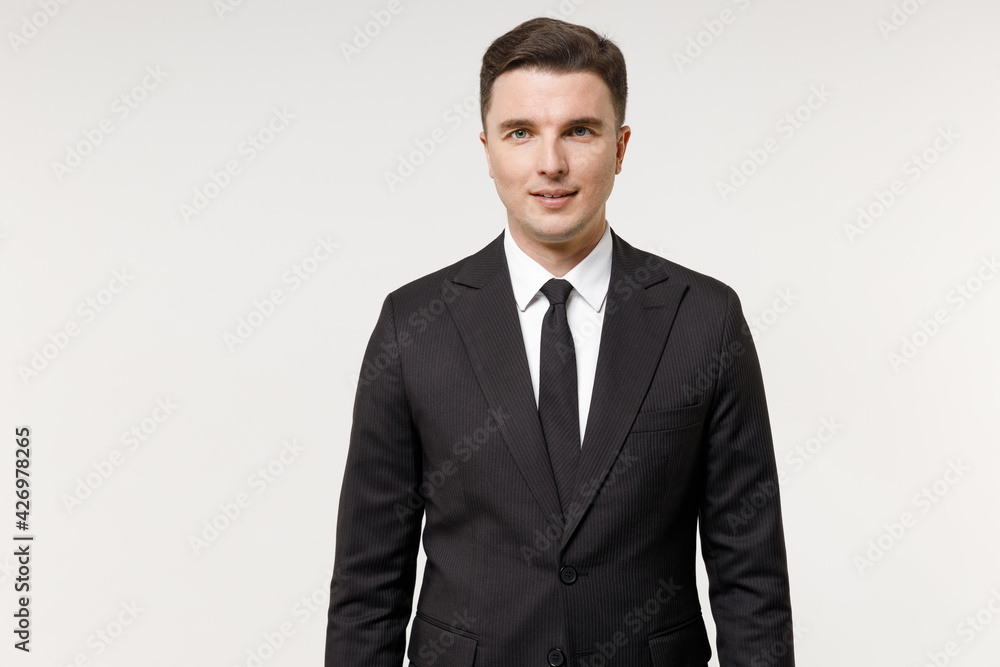 Young serious caucasian successful employee business corporate lawyer man 20s wear classic formal black grey suit shirt tie work in office isolated on white background studio portrait. Career concept. Young serious caucasian successful employee business corporate lawyer man 20s wear classic formal black grey suit shirt tie work in office isolated on white background studio portrait. Career concept.