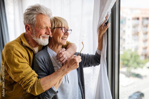 Happy senior couple in love hugging and bonding with true emotions photo