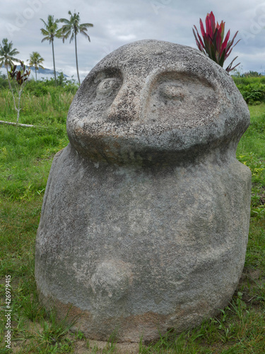 Landscape view of mysterious ancient megalith known as Oba in Lore Lindu National Park, Bada or Napu valley, Central Sulawesi, Indonesia photo