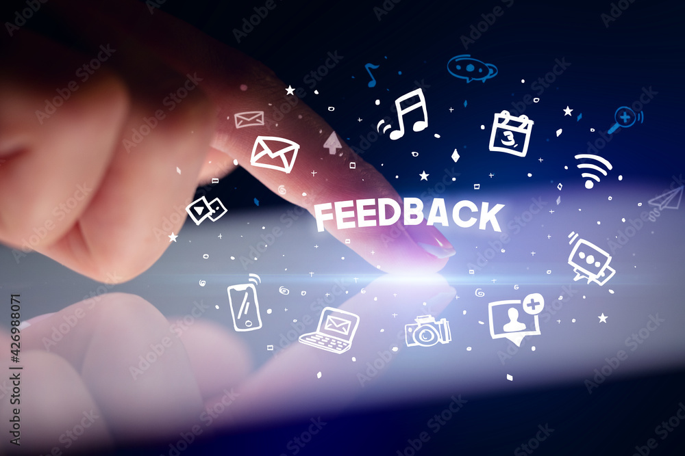 Finger touching tablet with social media icons concept Finger touching tablet with social media icons concept