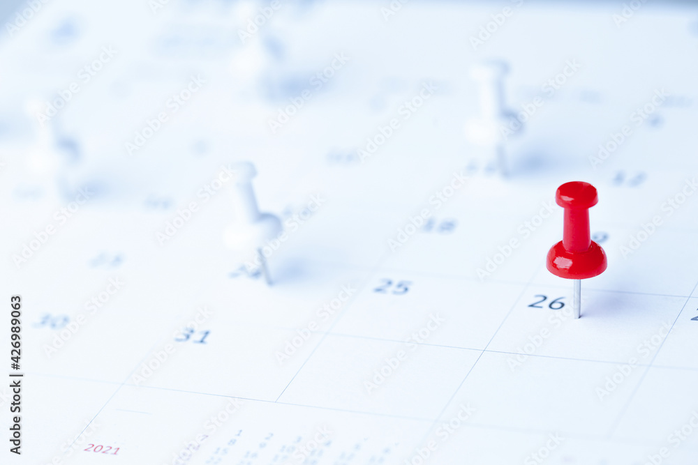 Thumbtack in calendar concept for busy, appointment and meeting reminder, planning for business meeting or travel planning concept. Thumbtack in calendar concept for busy, appointment and meeting reminder, planning for business meeting or travel planning concept.