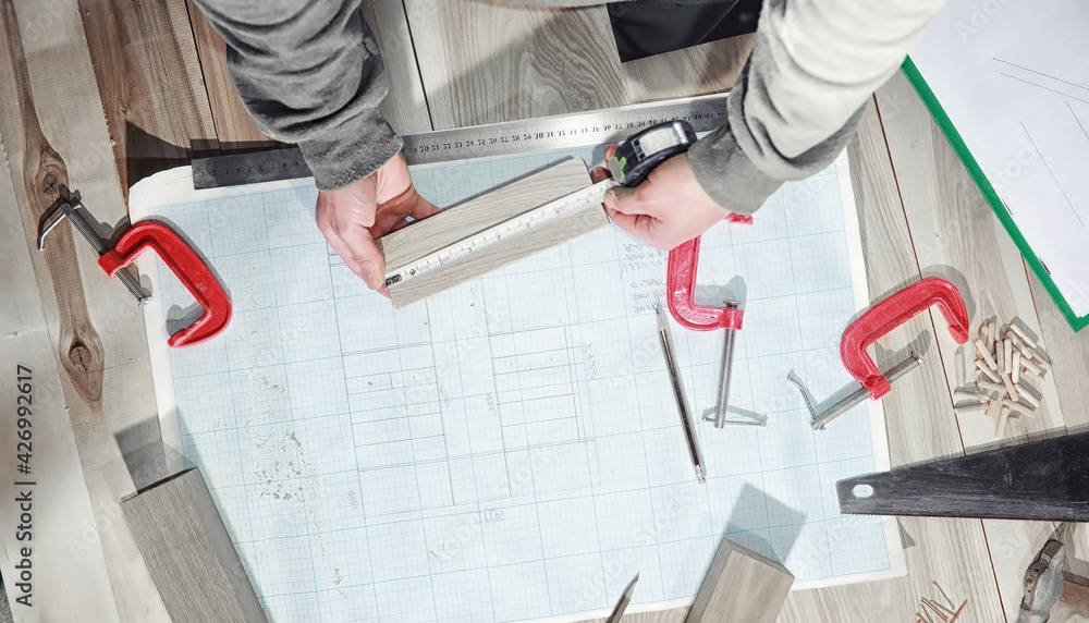 Workshop with tools and electric saws in the process Workshop with tools and electric saws in the process