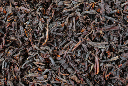 macro of black loose long leaf tea, loose tea texture