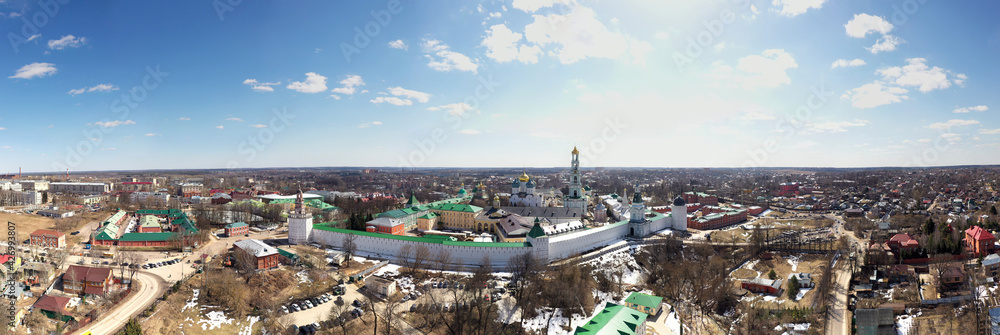 a panoramic view of the golden towers and ancient architectural solutions of the Trinity-Sergius Lavra in Sergiev Posad on a sunny spring day filmed from a drone a panoramic view of the golden towers and ancient architectural solutions of the Trinity-Sergius Lavra in Sergiev Posad on a sunny spring day filmed from a drone